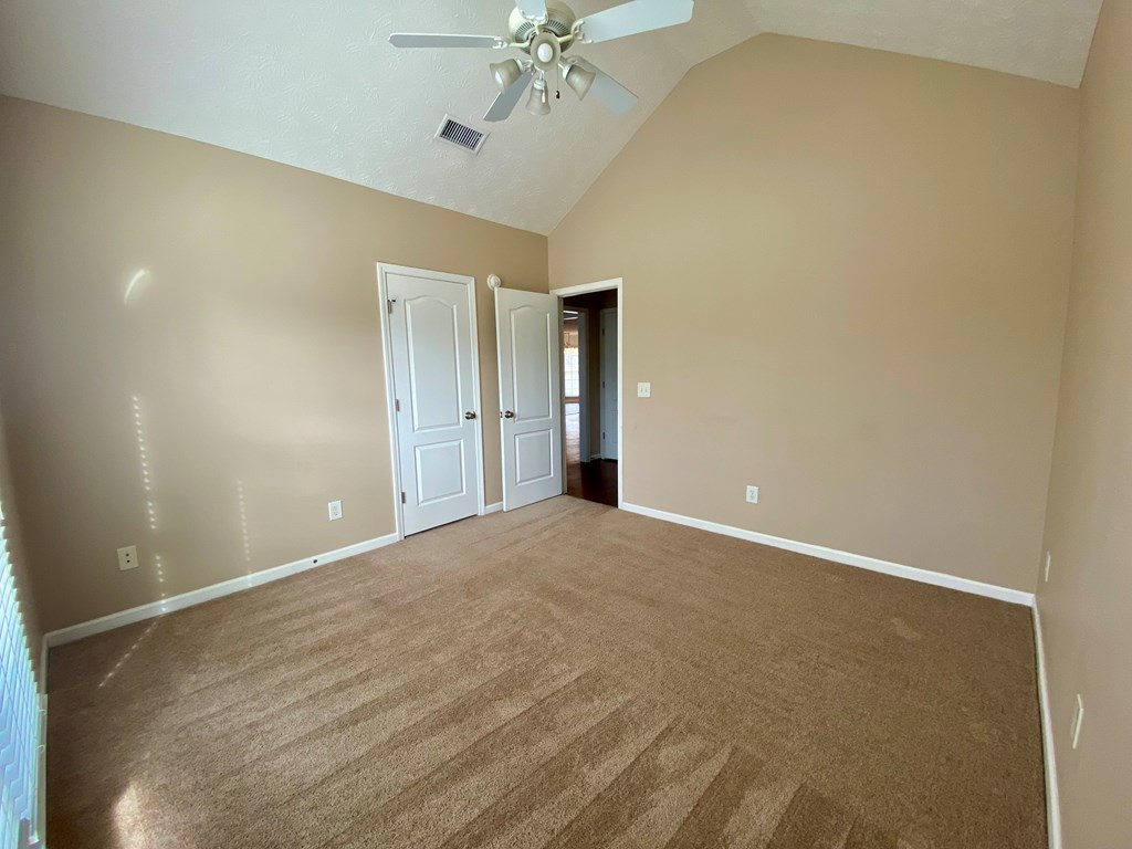 1815 Saffron Court Columbus, GA 31909 - Photo 13 of 20 a view of an empty room with a chandelier fan