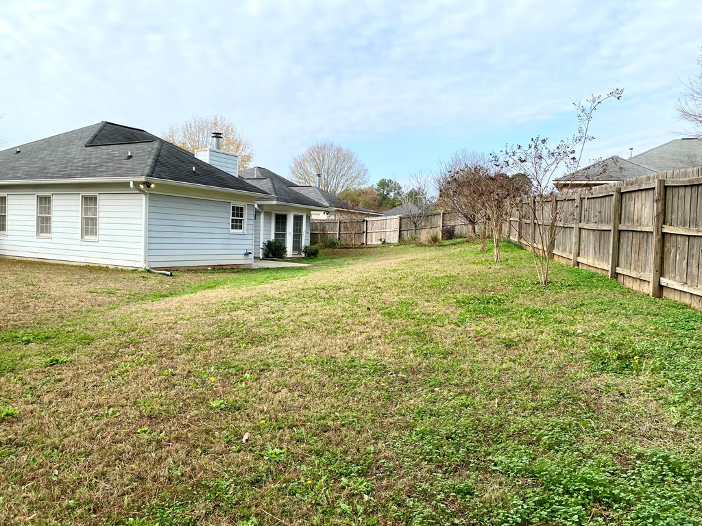 1815 Saffron Court Columbus, GA 31909 - Photo 19 of 20 a big house with a big yard and large trees