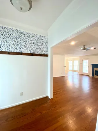 a view of a livingroom with wooden floor