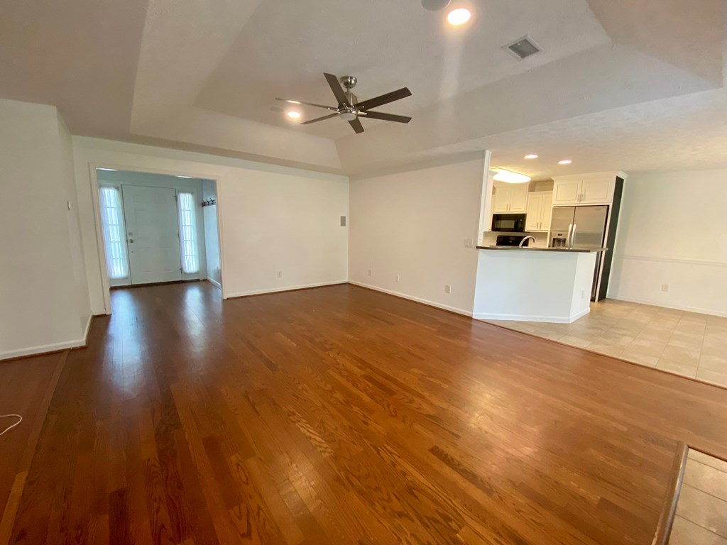 1815 Saffron Court Columbus, GA 31909 - Photo 3 of 20 a view of a kitchen with a sink and wooden floor