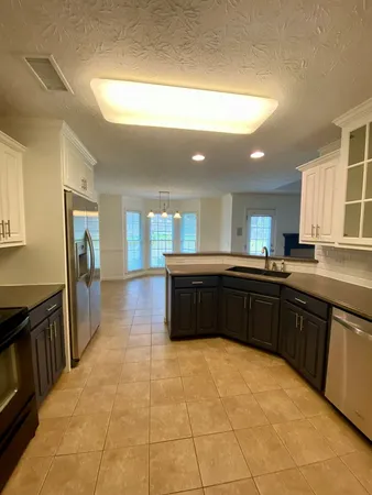 a kitchen with a sink and cabinets