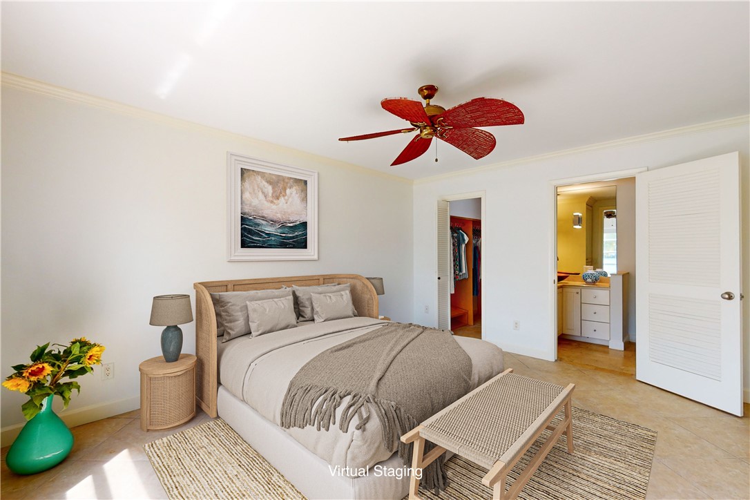 550 Riomar Drive, Unit 24 Vero Beach, FL 32963 - Photo 12 of 35 a bedroom with a bed and wooden floor