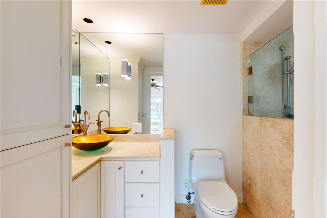 550 Riomar Drive, Unit 24 Vero Beach, FL 32963 - Photo 16 of 35 a bathroom with a granite countertop sink and a mirror