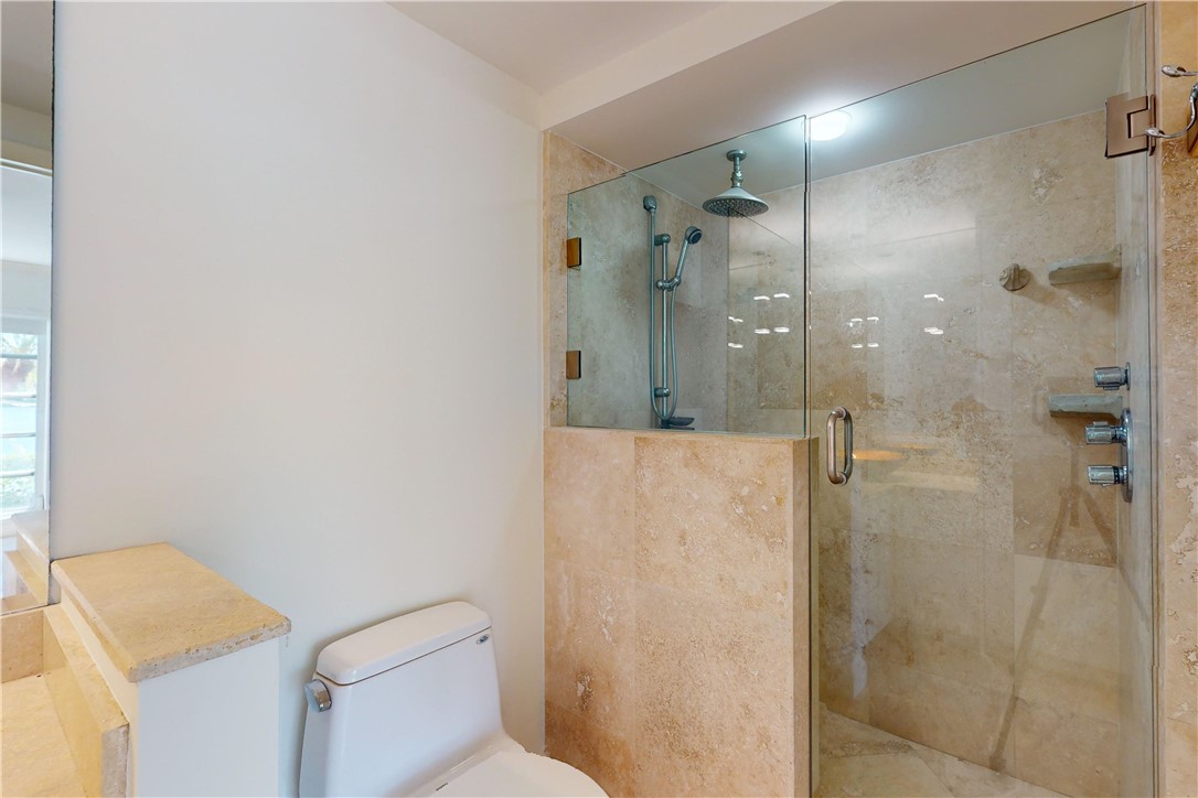 550 Riomar Drive, Unit 24 Vero Beach, FL 32963 - Photo 17 of 35 a bathroom with a shower a toilet and sink