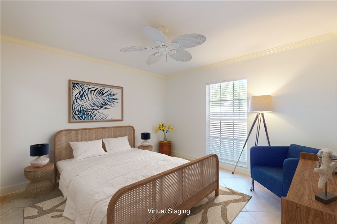 550 Riomar Drive, Unit 24 Vero Beach, FL 32963 - Photo 18 of 35 a bedroom with a bed and wooden floor