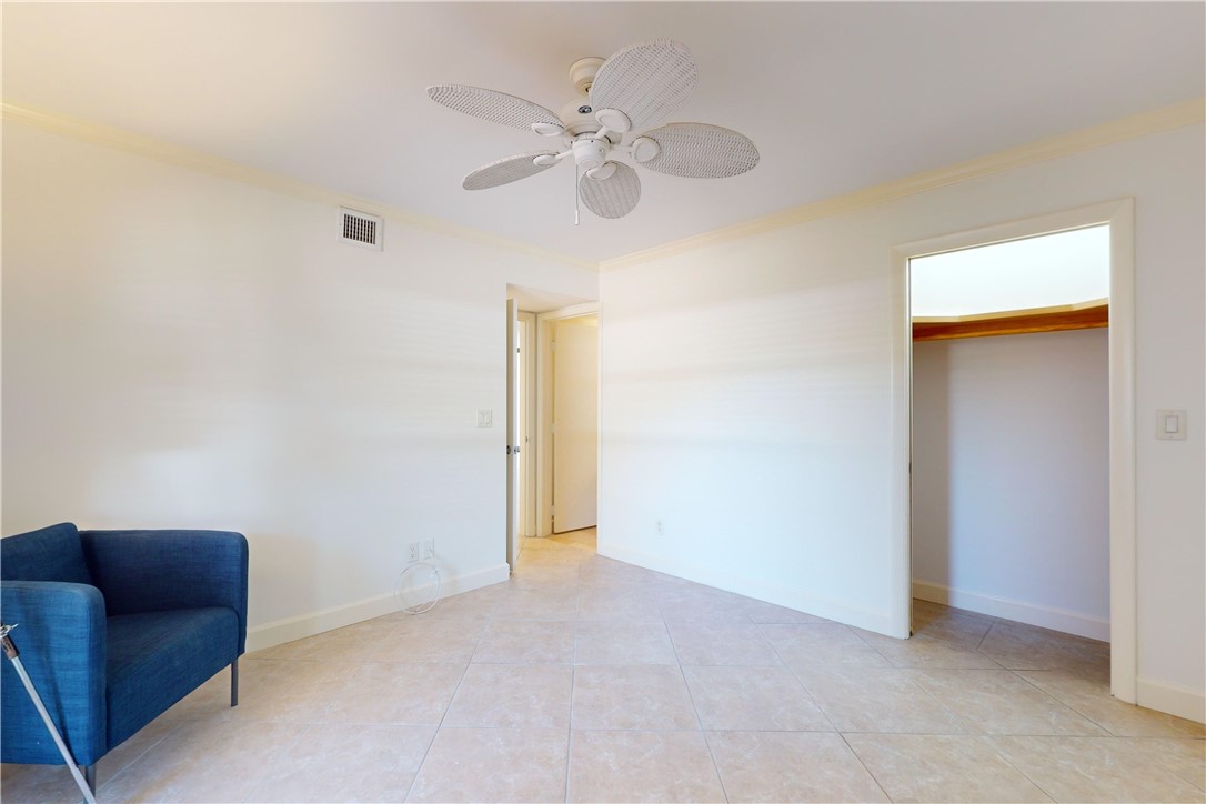 550 Riomar Drive, Unit 24 Vero Beach, FL 32963 - Photo 21 of 35 an empty room with windows and fan