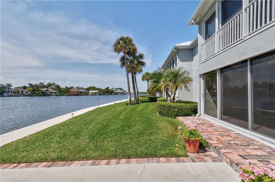 550 Riomar Drive, Unit 24 Vero Beach, FL 32963 - Photo 25 of 35 a view of a garden with a lake