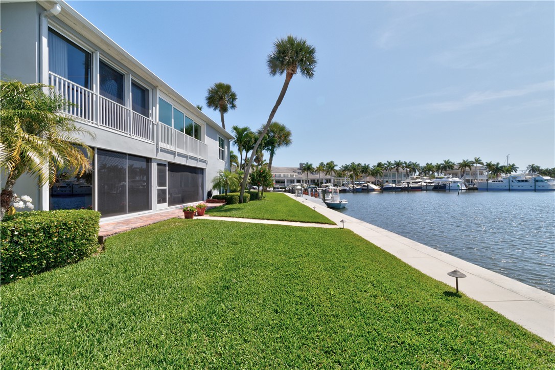 550 Riomar Drive, Unit 24 Vero Beach, FL 32963 - Photo 26 of 35 a view of a house with a yard and a fountain