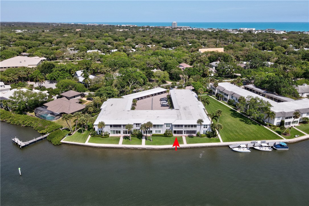 550 Riomar Drive, Unit 24 Vero Beach, FL 32963 - Photo 27 of 35 an aerial view of residential houses with outdoor space and parking