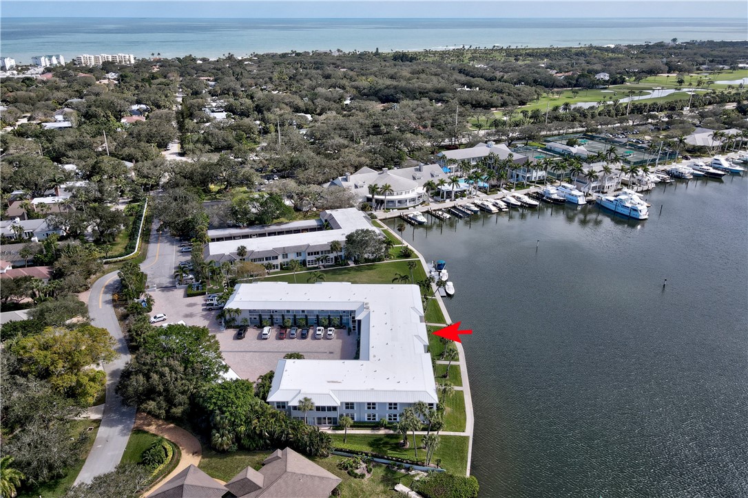 550 Riomar Drive, Unit 24 Vero Beach, FL 32963 - Photo 33 of 35 an aerial view of a house with a lake view