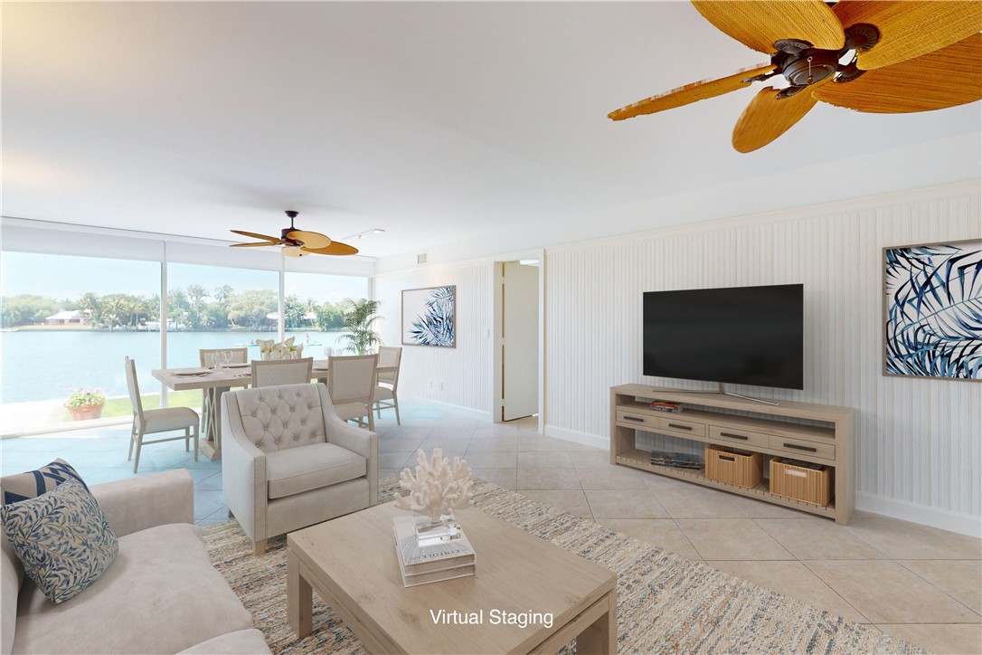 550 Riomar Drive, Unit 24 Vero Beach, FL 32963 - Photo 4 of 35 a living room with furniture and a flat screen tv
