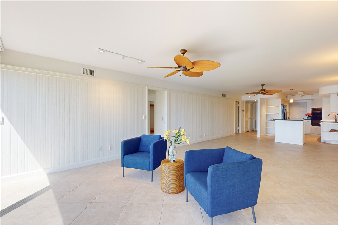 550 Riomar Drive, Unit 24 Vero Beach, FL 32963 - Photo 7 of 35 a living room with furniture and a chandelier