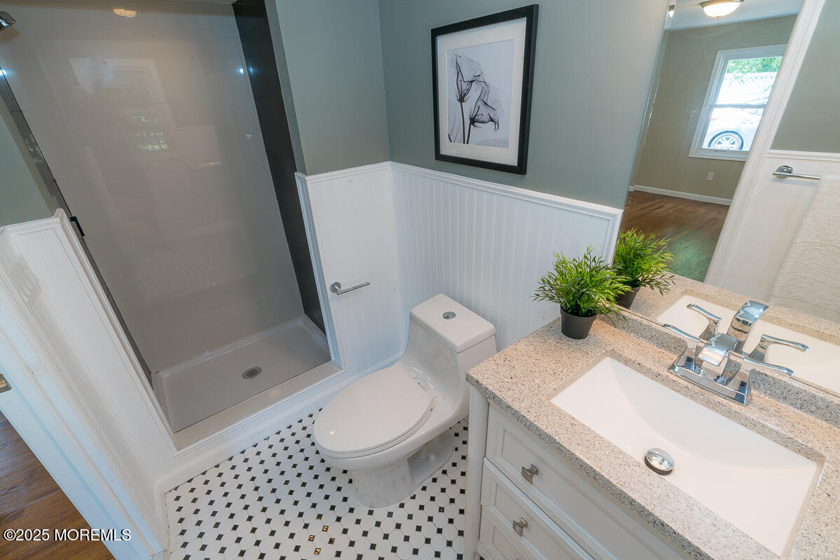 21 Wickatunk Road Manalapan, NJ 07726 - Photo 17 of 48 a bathroom with a sink and a mirror