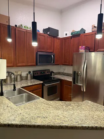 a view of a refrigerator in kitchen