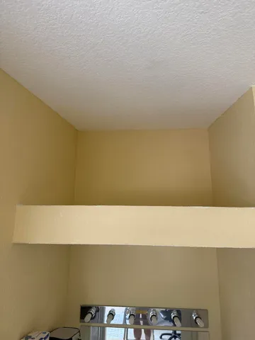 a view of hallway with windows