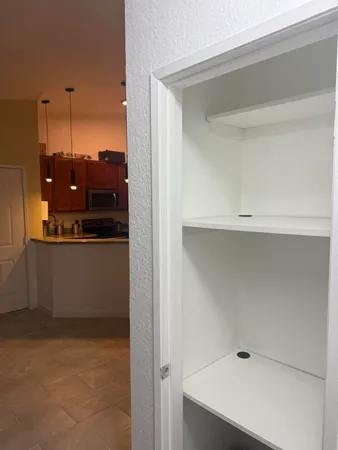 a view of balcony with furniture