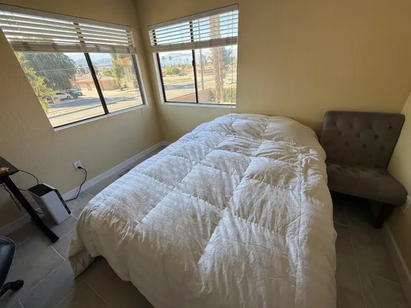 a swimming pool with outdoor seating and yard