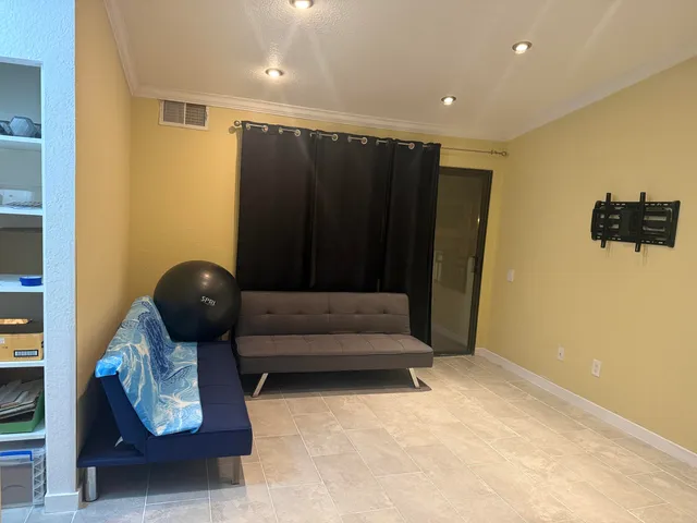 a view of walk in closet with empty racks