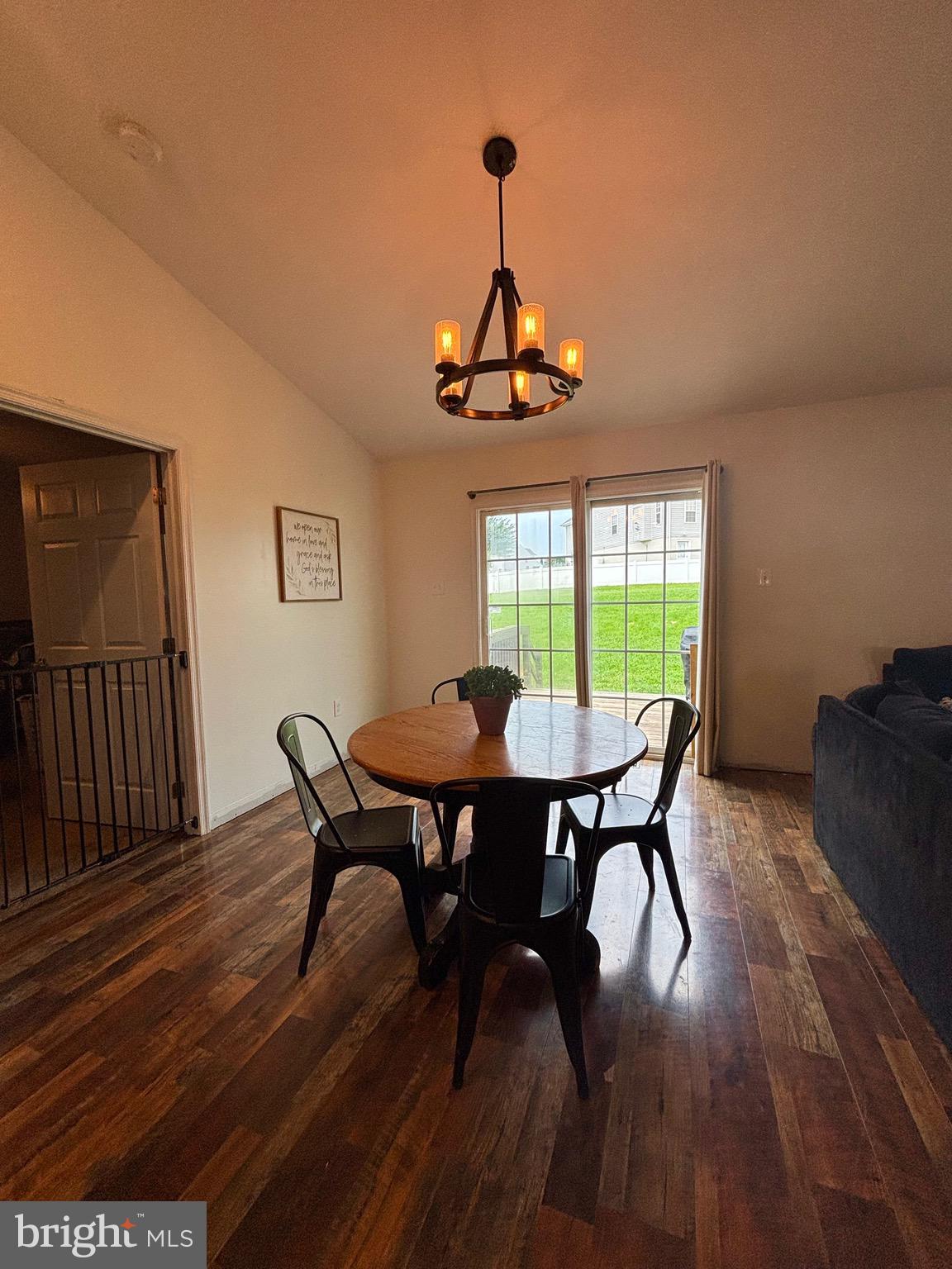 56 Reprisal Road Inwood, WV 25428 - Photo 12 of 31 a view of a dining room with furniture window and wooden floor