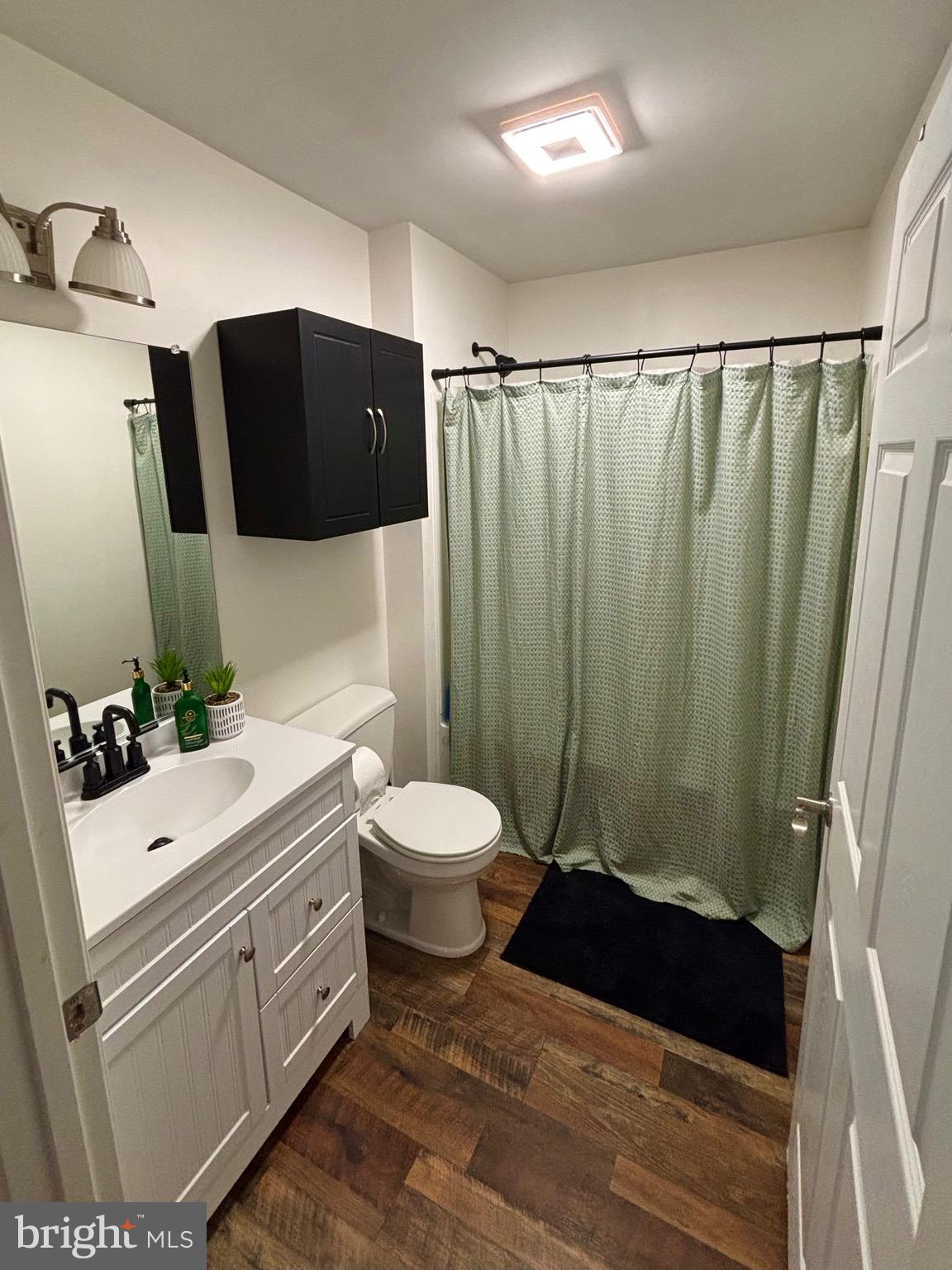 56 Reprisal Road Inwood, WV 25428 - Photo 3 of 31 a bathroom with a sink a toilet and shower