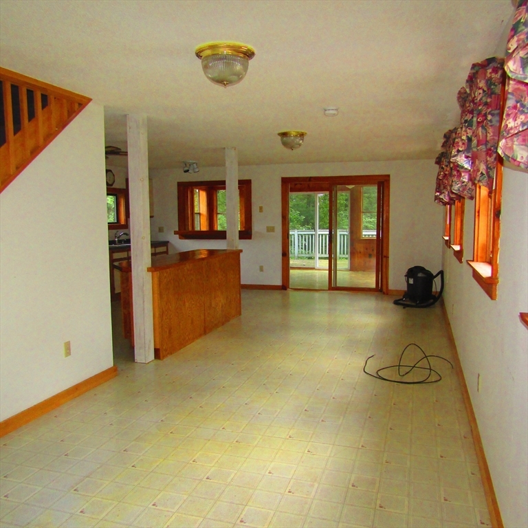 79 Aqua Vitae Road Hadley, MA 01035 - Photo 15 of 25 a view of a livingroom with furniture and windows