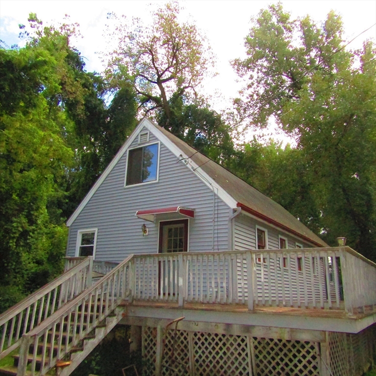 79 Aqua Vitae Road Hadley, MA 01035 - Photo 2 of 25 a front view of a house with a garden
