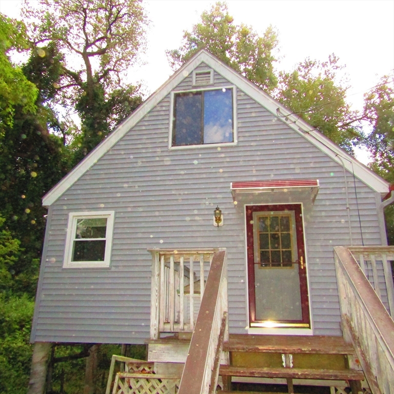 79 Aqua Vitae Road Hadley, MA 01035 - Photo 4 of 25 a view of a house with a yard