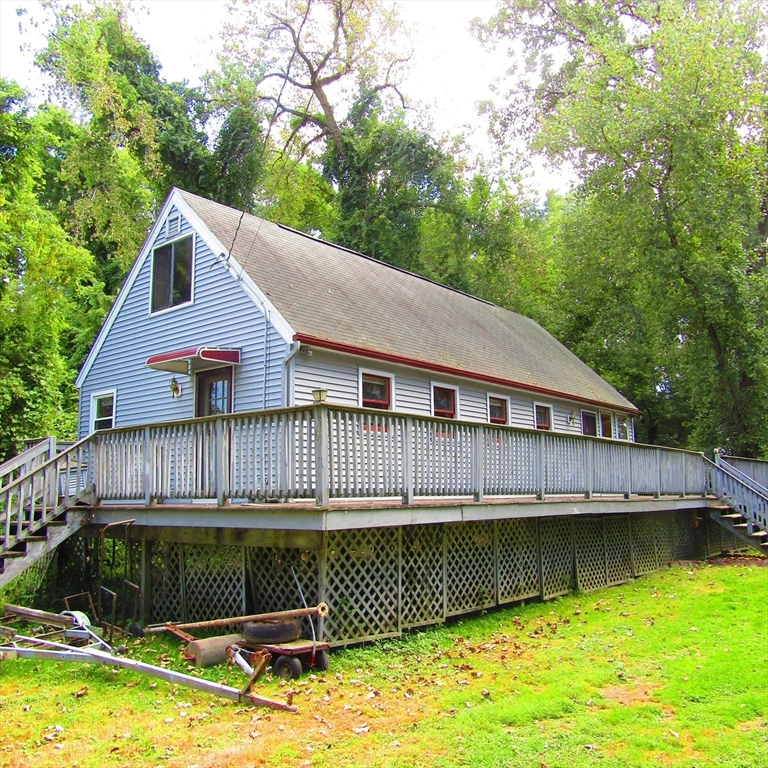 79 Aqua Vitae Road Hadley, MA 01035 - Photo 5 of 25 a view of a house with swimming pool next to a yard