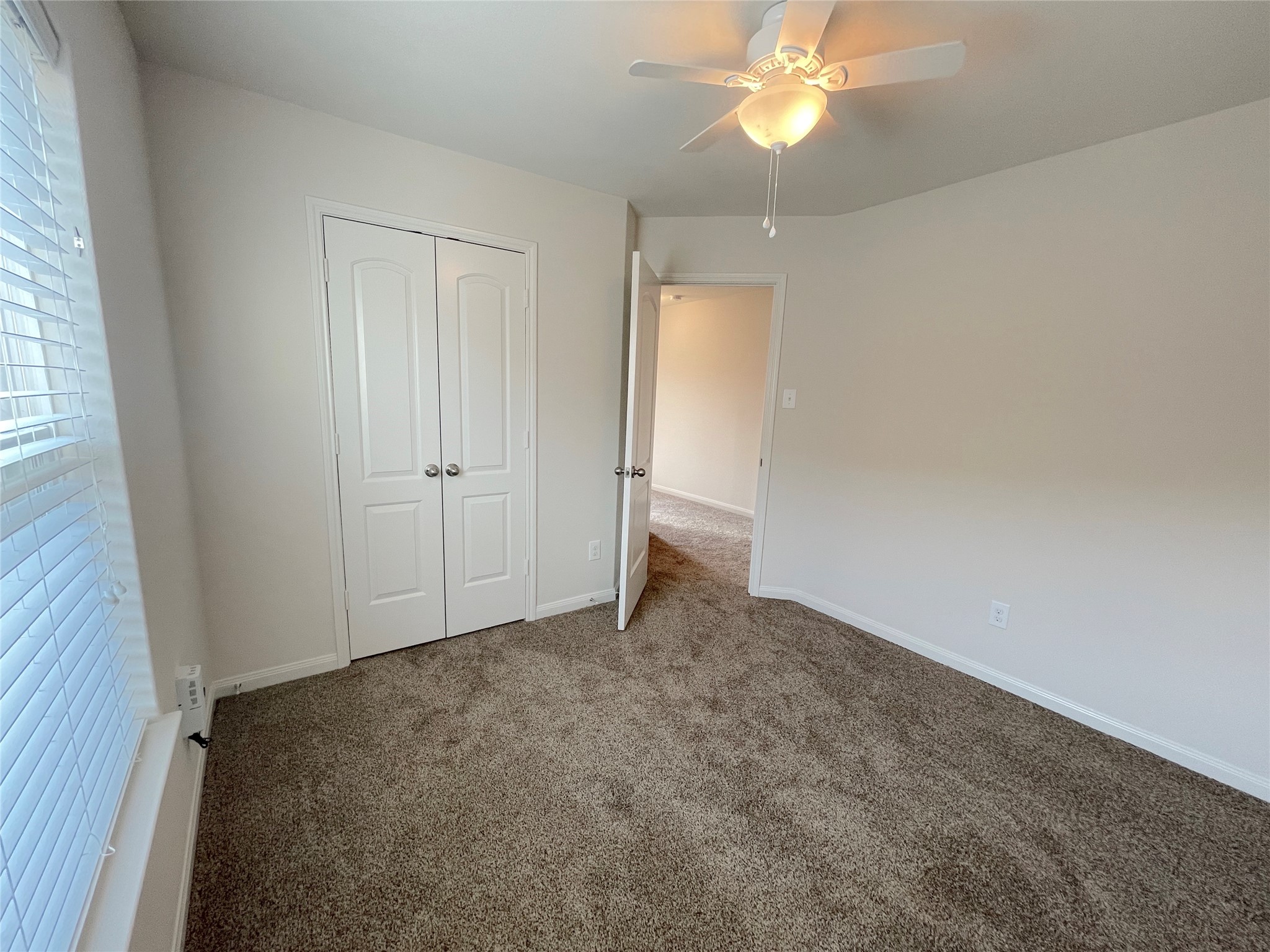 20714 Round Key Drive Hockley, TX 77447 - Photo 7 of 20 an empty room with closet and fan