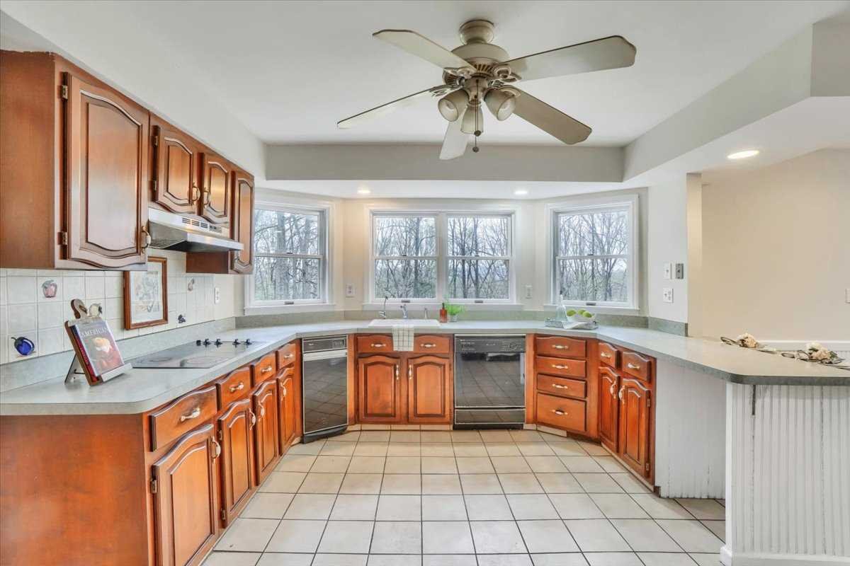 158 Bohl Road East Fishkill, NY 12533 - Photo 13 of 39 a large kitchen with stainless steel appliances granite countertop a sink and cabinets