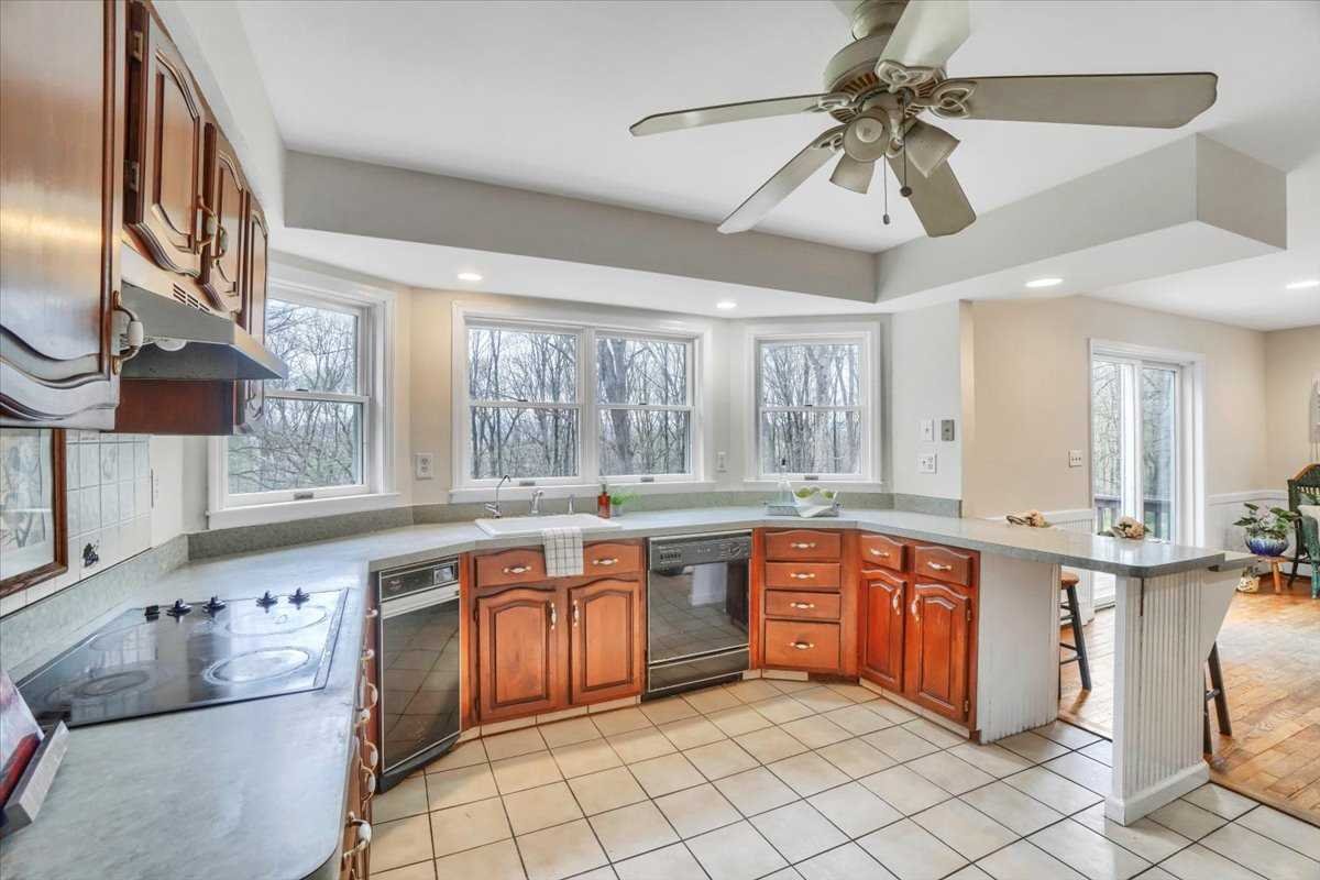 158 Bohl Road East Fishkill, NY 12533 - Photo 15 of 39 a large kitchen with cabinets and chairs