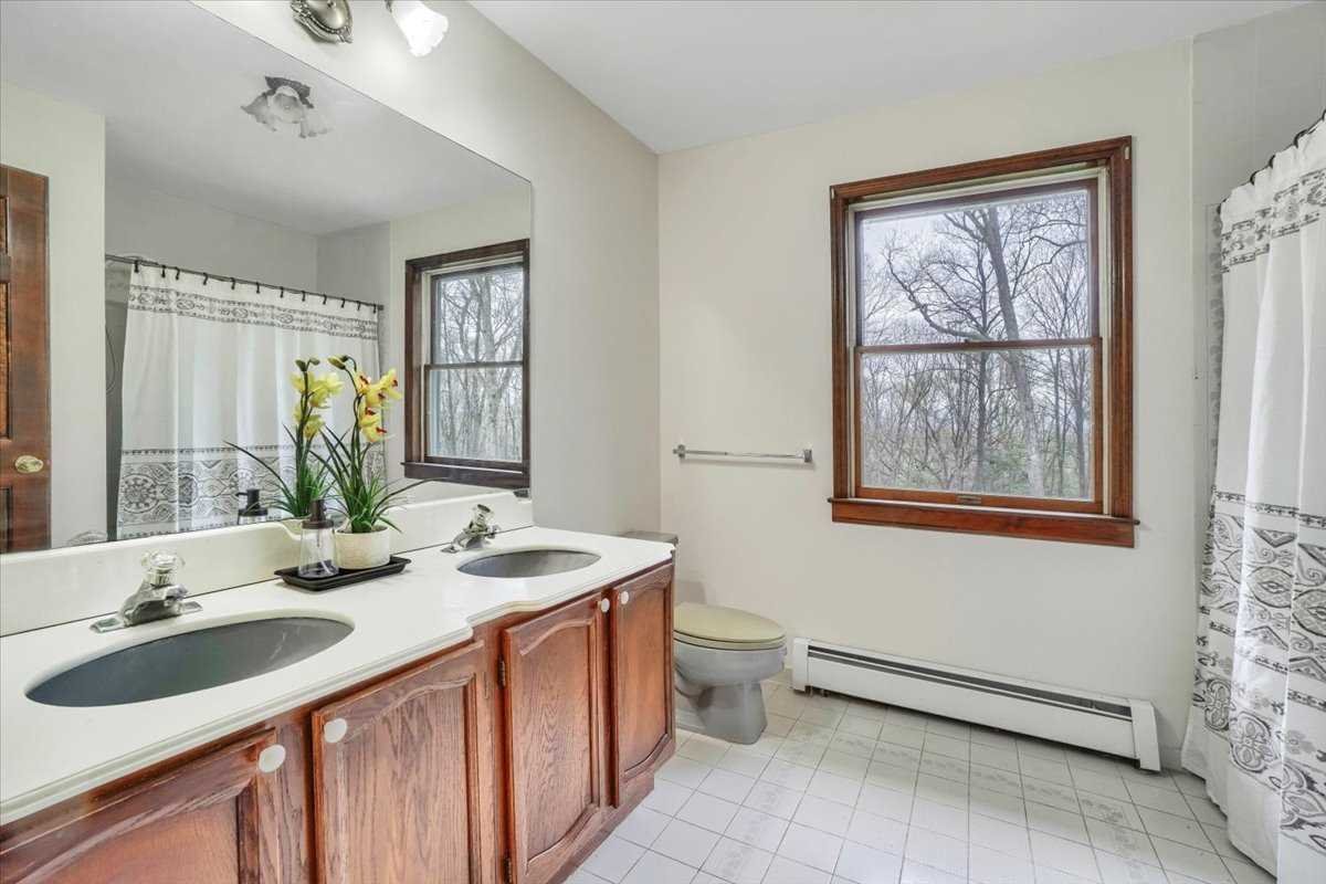 158 Bohl Road East Fishkill, NY 12533 - Photo 25 of 39 a bathroom with a double vanity sink and a mirror