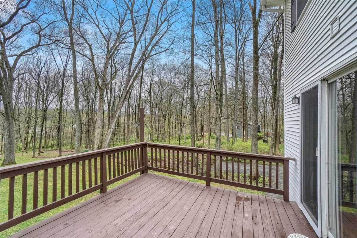 158 Bohl Road East Fishkill, NY 12533 - Photo 32 of 39 a view of a wooden balcony with trees