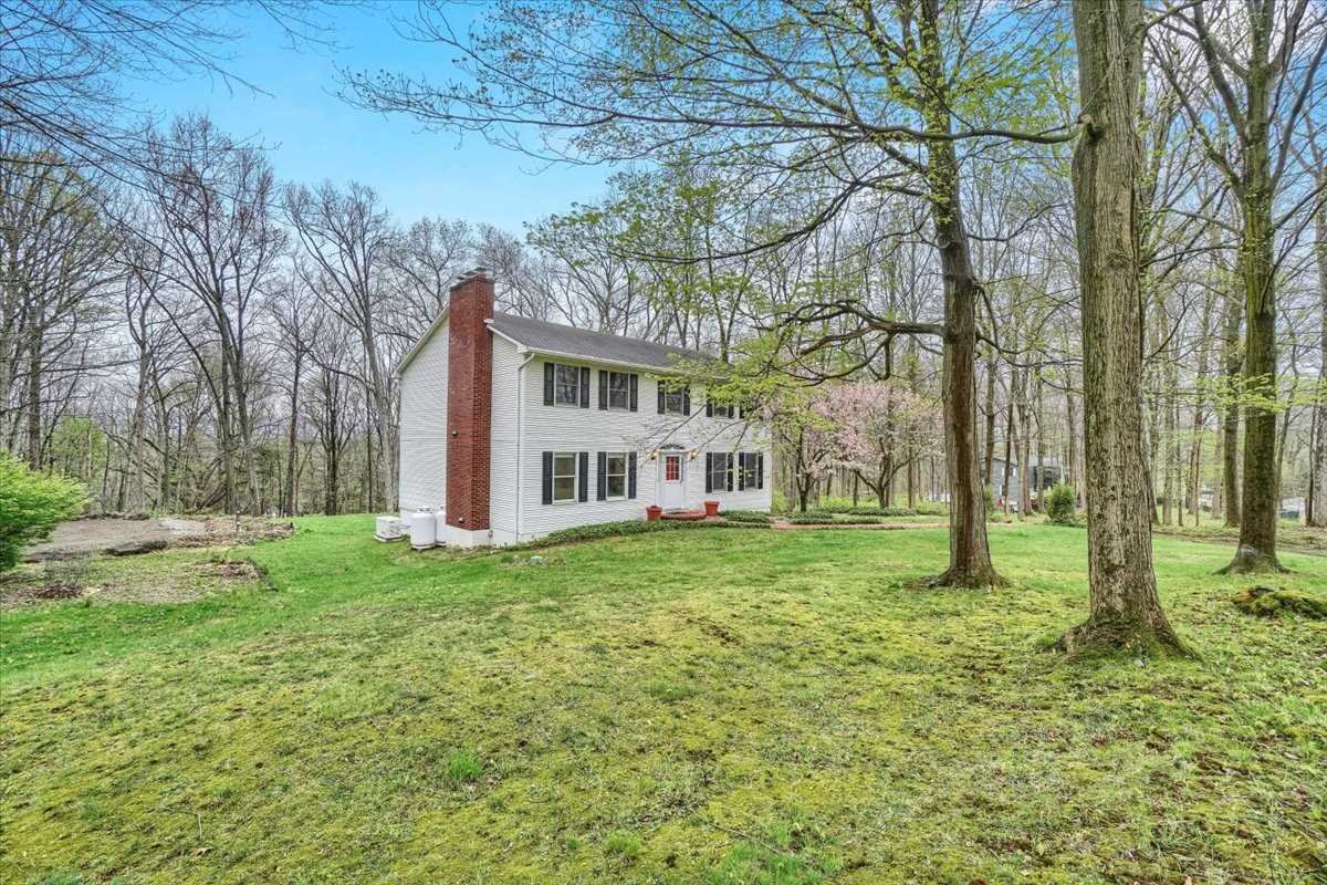 158 Bohl Road East Fishkill, NY 12533 - Photo 5 of 39 a view of a house with a big yard and large trees