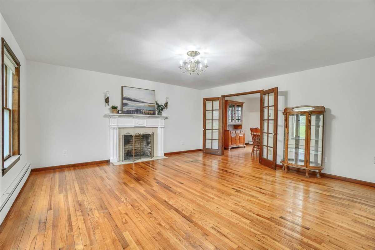 158 Bohl Road East Fishkill, NY 12533 - Photo 10 of 39 a view of an empty room with wooden floor and a window