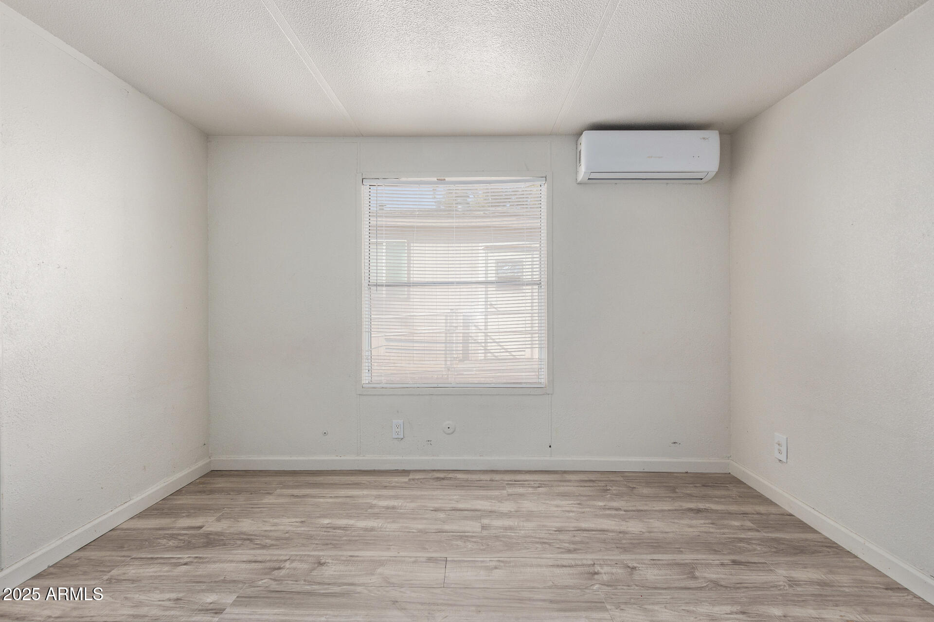 1221 North Dysart Road, Unit 35 Avondale, AZ 85323 - Photo 16 of 22 an empty room with a empty space and a window