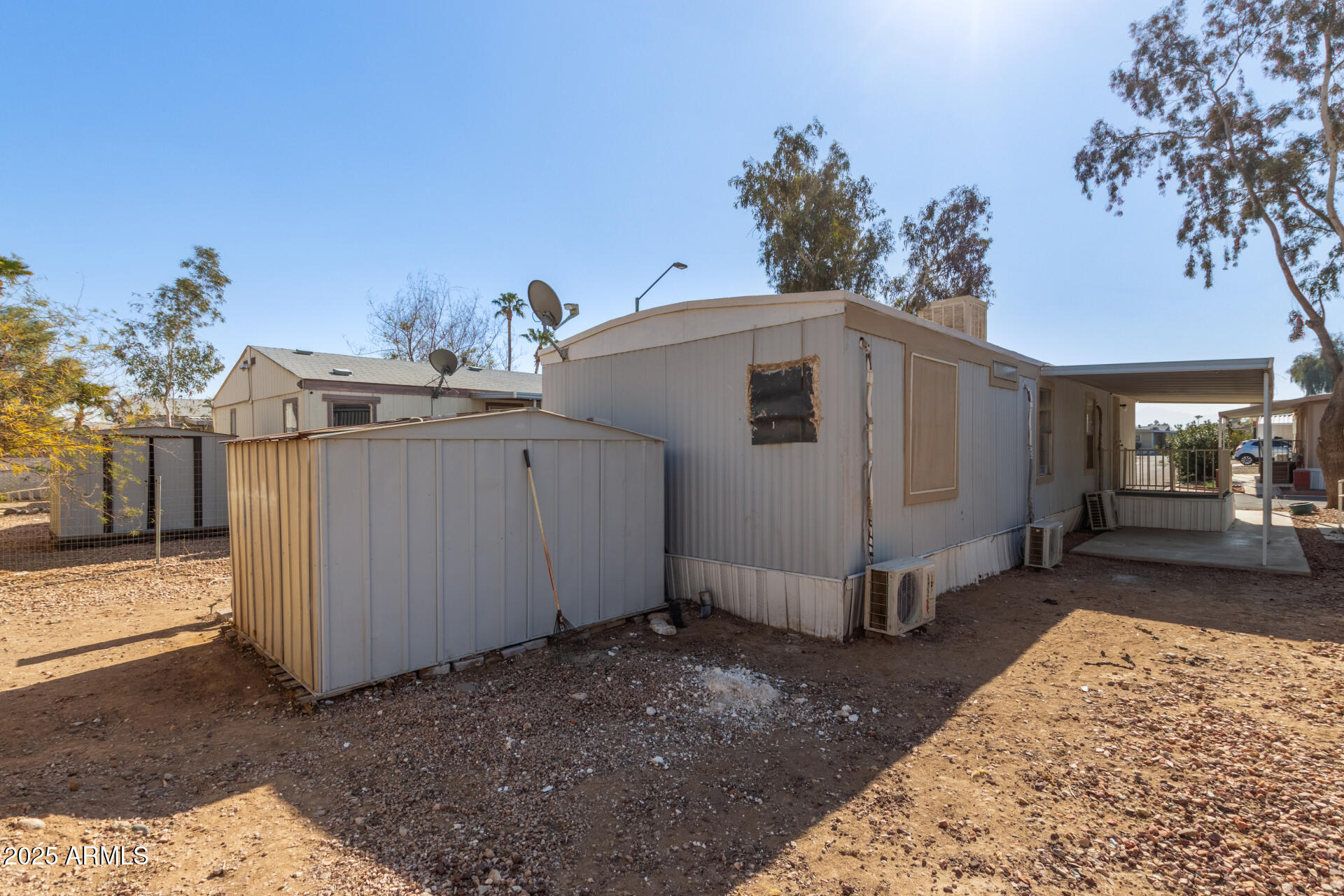 1221 North Dysart Road, Unit 35 Avondale, AZ 85323 - Photo 21 of 22 a view of a house with a backyard and garage