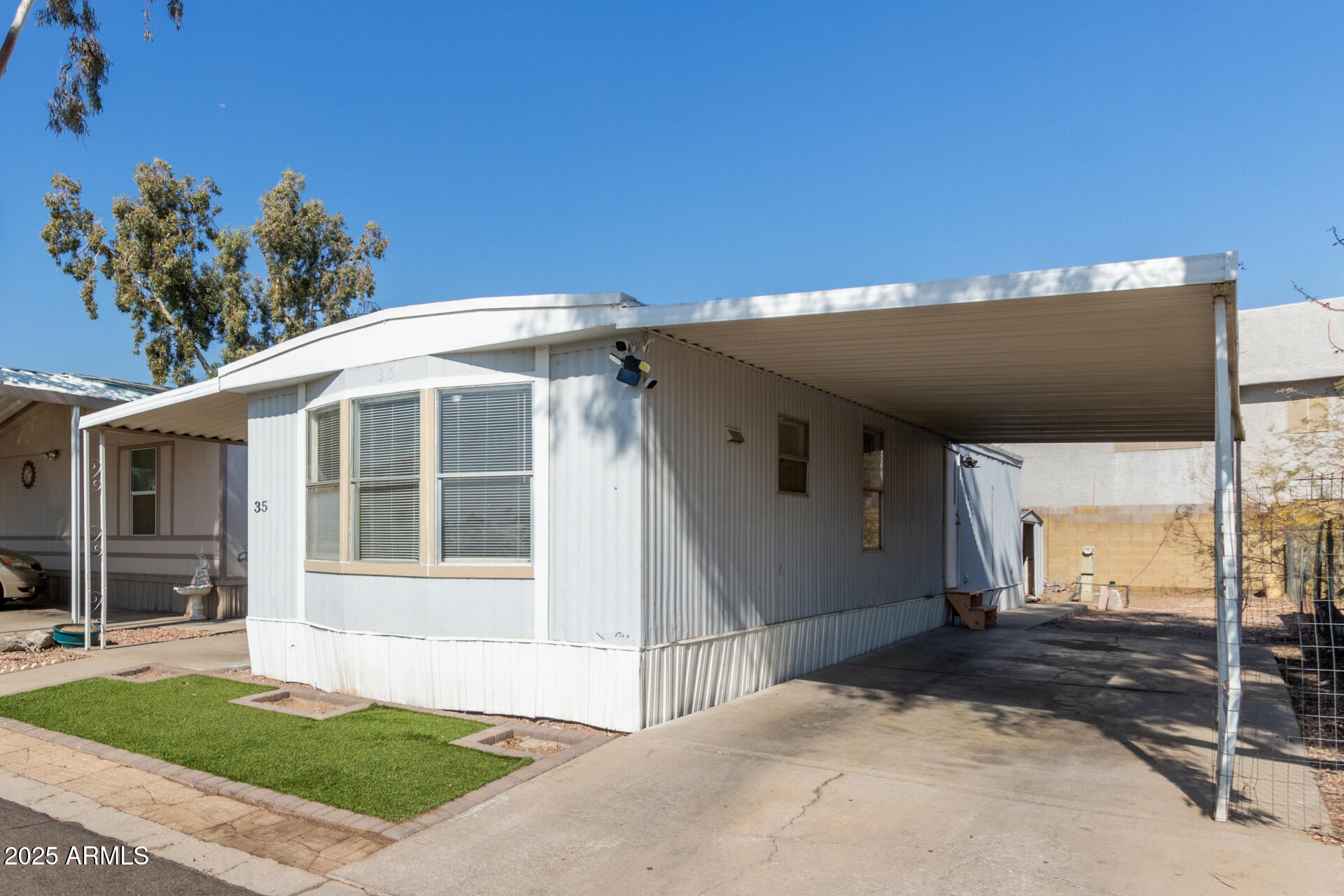 1221 North Dysart Road, Unit 35 Avondale, AZ 85323 - Photo 5 of 22 a view of a house with a backyard