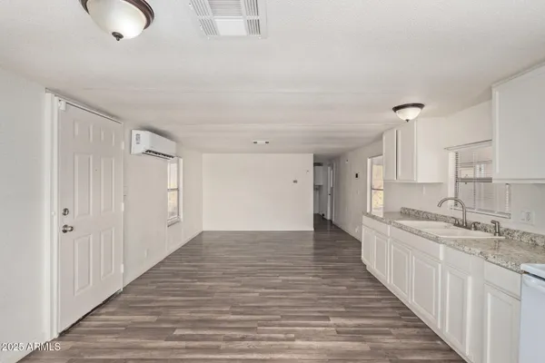 a view of a kitchen from the hallway