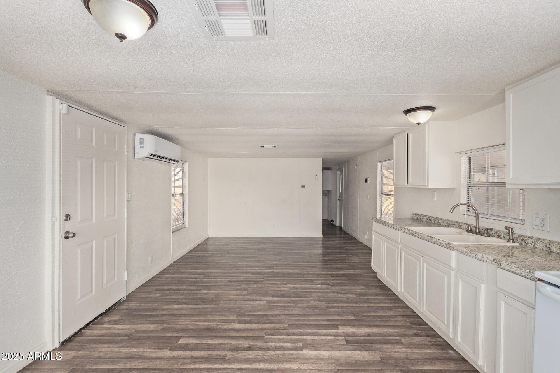 1221 North Dysart Road, Unit 35 Avondale, AZ 85323 - Photo 8 of 22 a view of a kitchen from the hallway