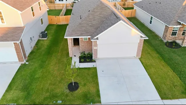 an aerial view of a house with swimming pool