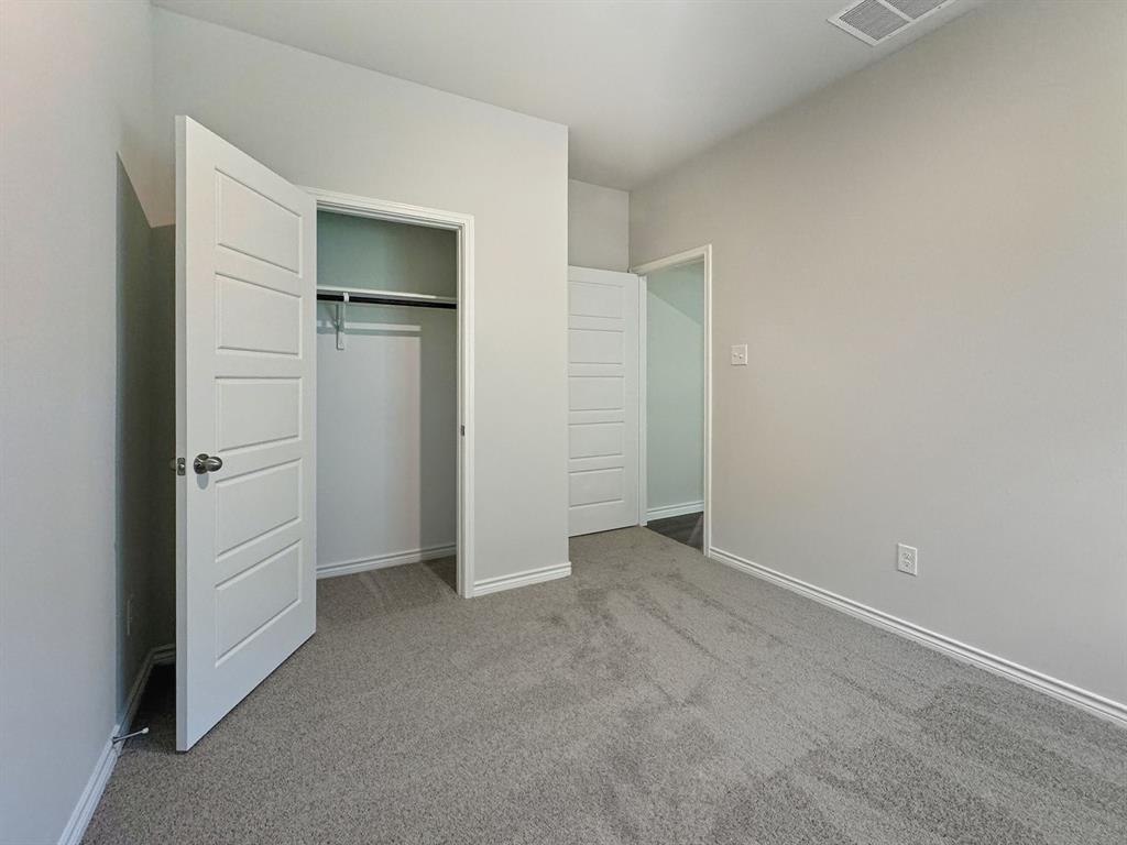 9944 Dynamic Drive Fort Worth, TX 76131 - Photo 12 of 17 an empty room with closet