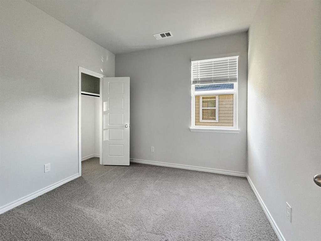 9944 Dynamic Drive Fort Worth, TX 76131 - Photo 15 of 17 an empty room with windows