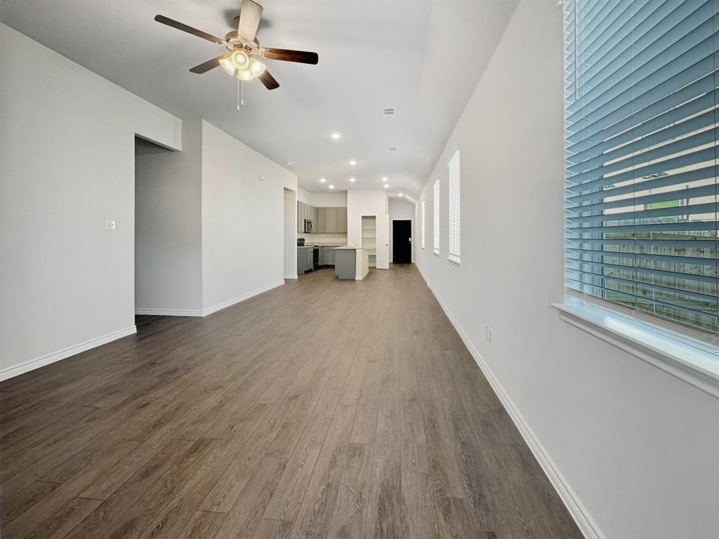 9944 Dynamic Drive Fort Worth, TX 76131 - Photo 7 of 17 a view of a room with wooden floor and ceiling fan