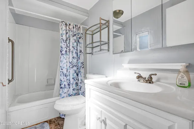 a bedroom with furniture and a wooden floor