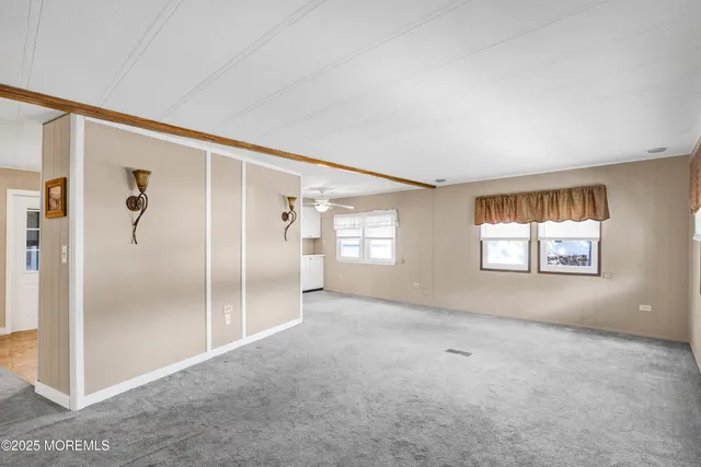 a view of empty room with windows