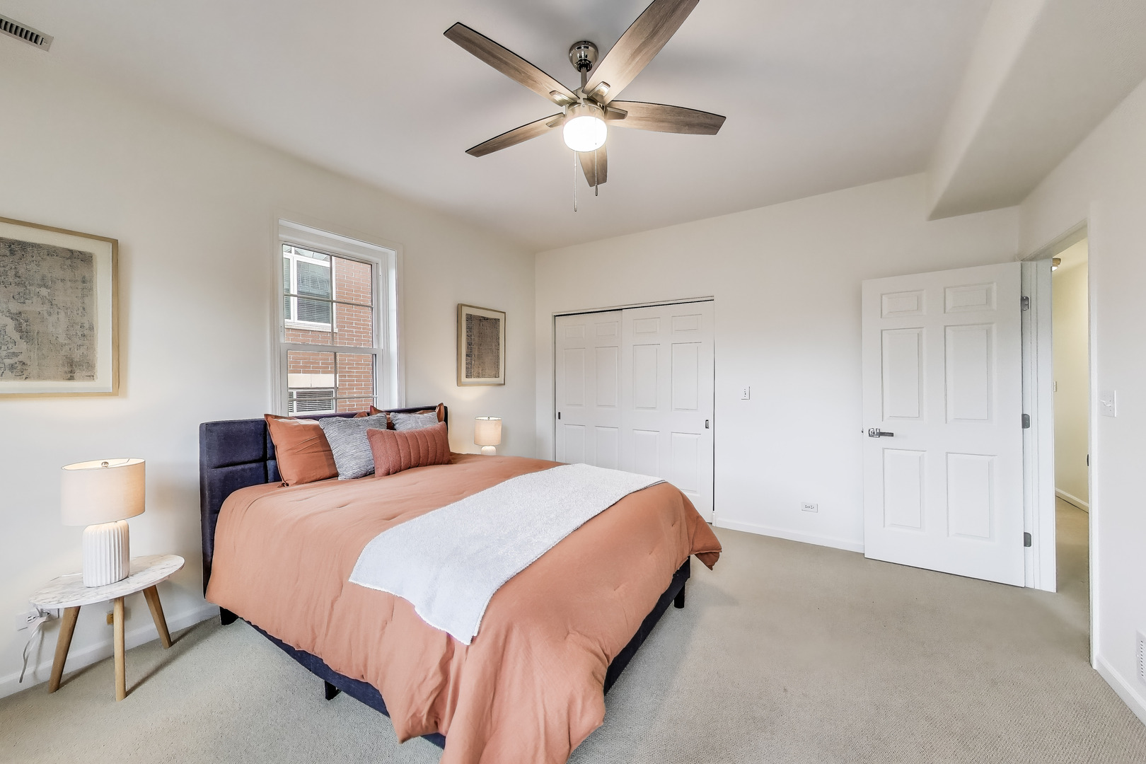 1034 West Monroe Street Chicago, IL 60607 - Photo 18 of 26 a bedroom with a bed and a chandelier
