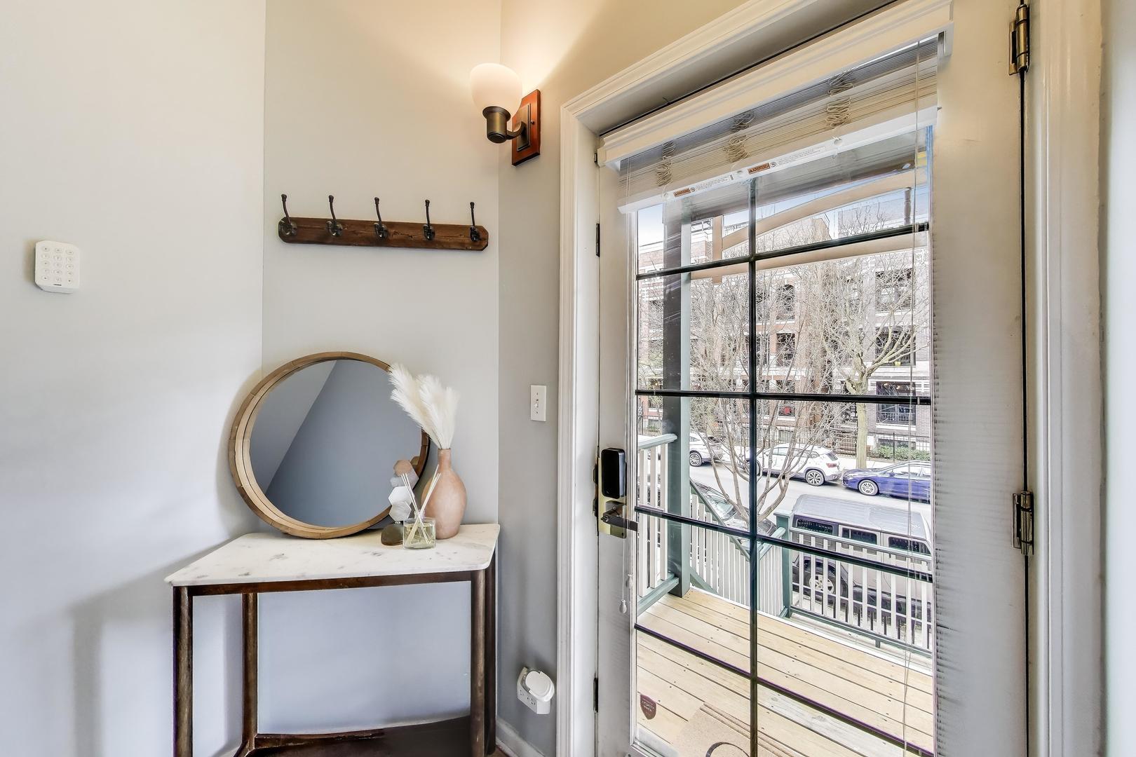 1034 West Monroe Street Chicago, IL 60607 - Photo 20 of 26 a bathroom with a toilet a sink and a mirror
