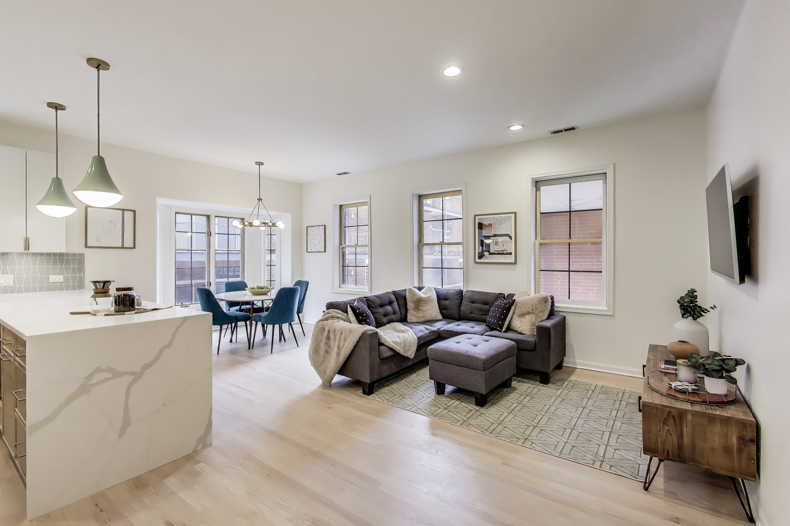 1034 West Monroe Street Chicago, IL 60607 - Photo 3 of 26 a living room with furniture and a flat screen tv