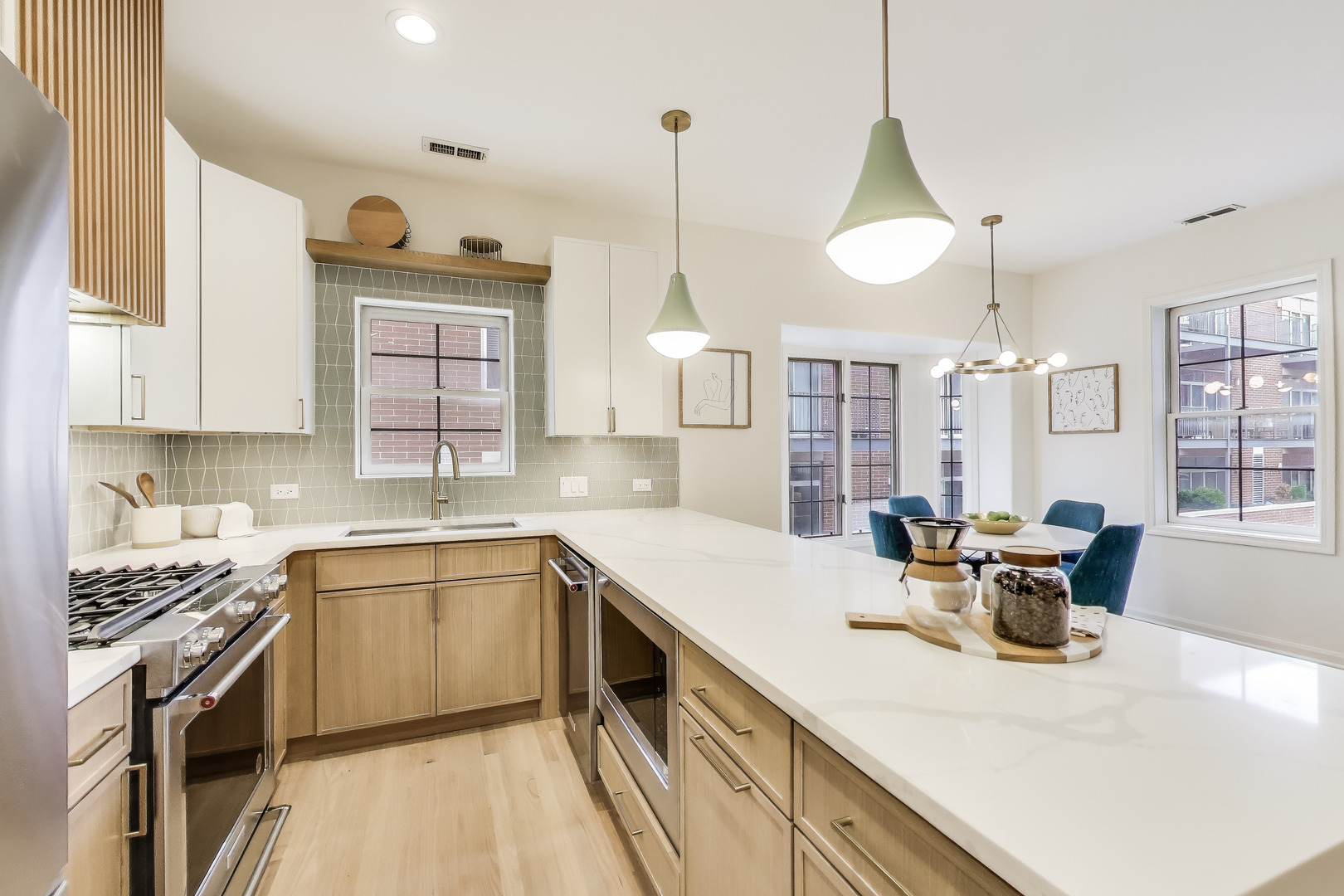 1034 West Monroe Street Chicago, IL 60607 - Photo 6 of 26 a kitchen with a sink cabinets and window